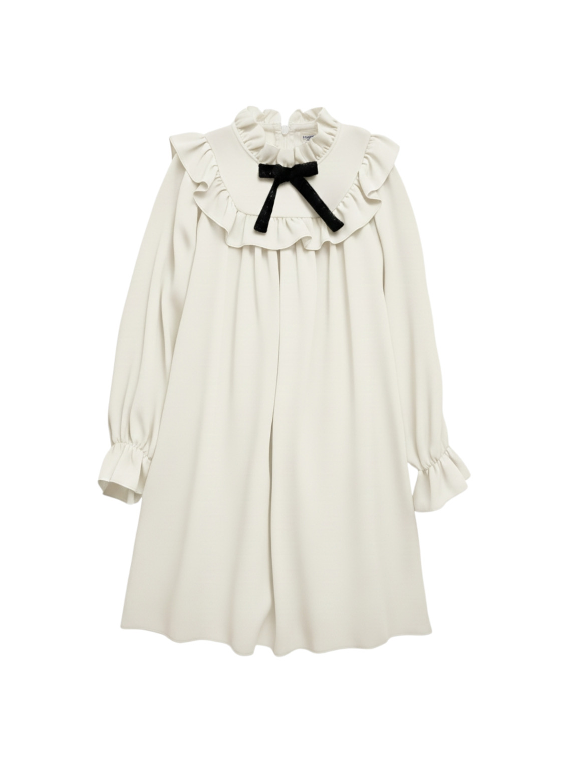 Cloud Dancer Girls Dress Tili Studio The Cloud Dancer girl's dress in cream white. The dress features long sleeves, a ruffle collar, and a small black velvet bow at the neckline.