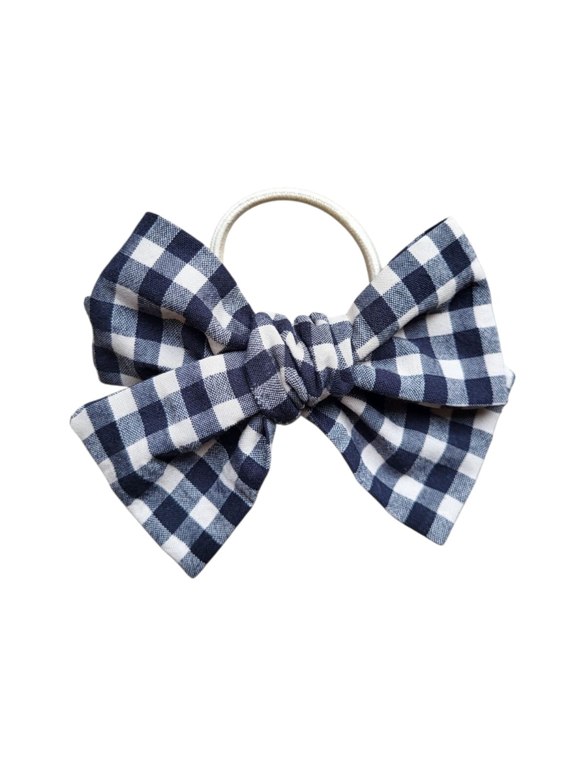 Klasiska melnbalta rūtaina auduma matu bante ar bēšu matu gumiju.